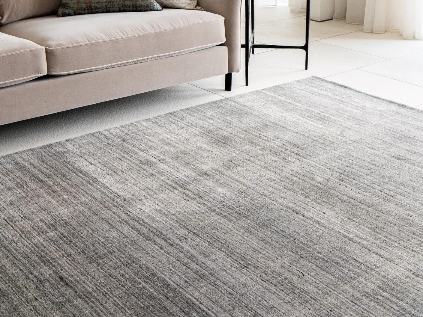 Ava Ashton carpets in grey and charcoal, shown in a lifestyle close-up as image 1