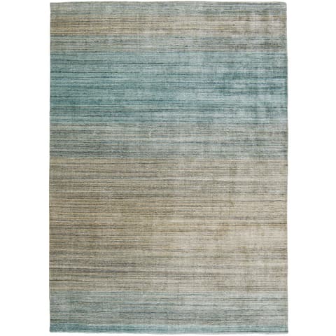 Ava Sandy carpets in turquoise and beige, shown in a product top view as image 1