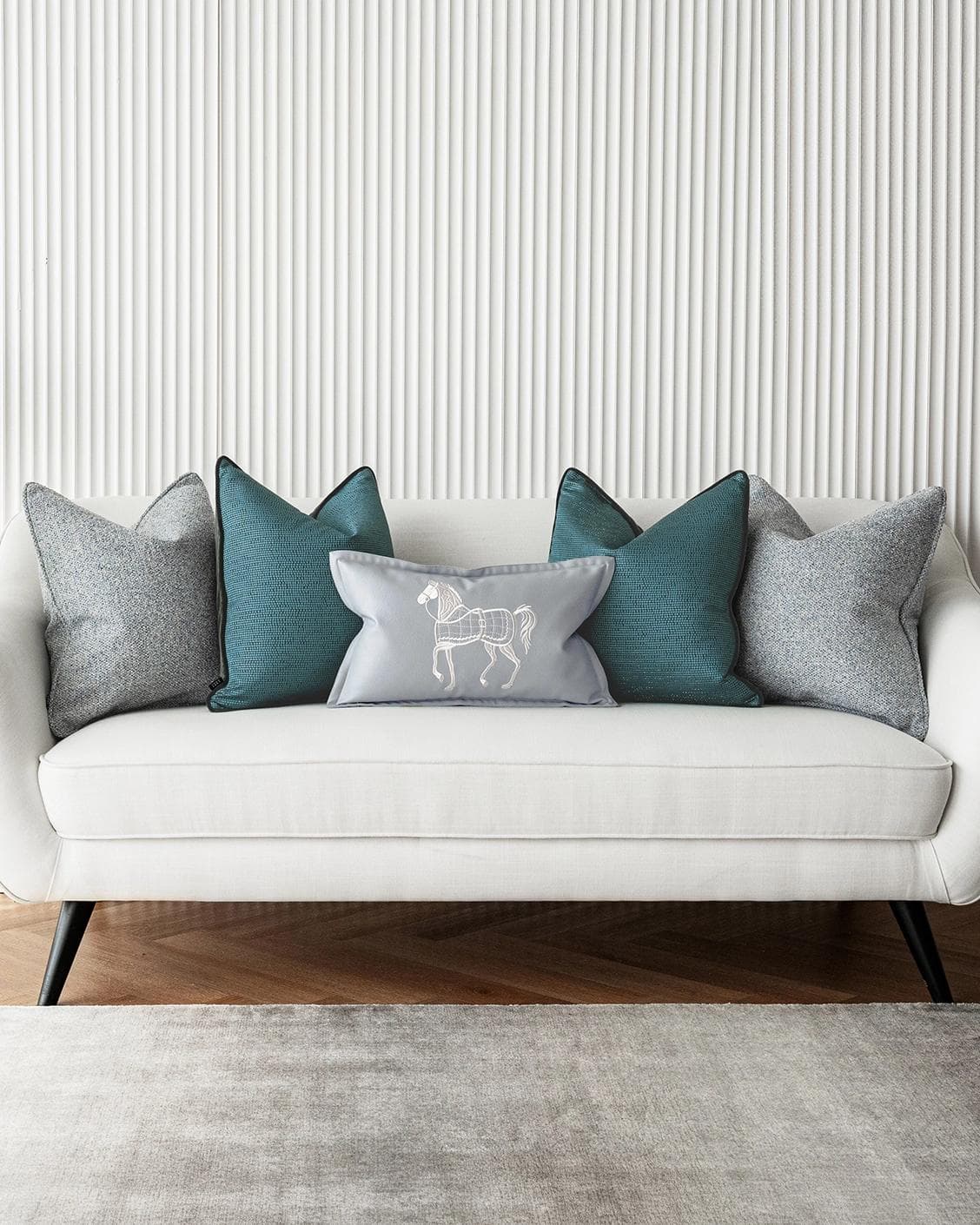 Henrich Bundle cushion in blue, shown in a lifestyle front view as image 4
