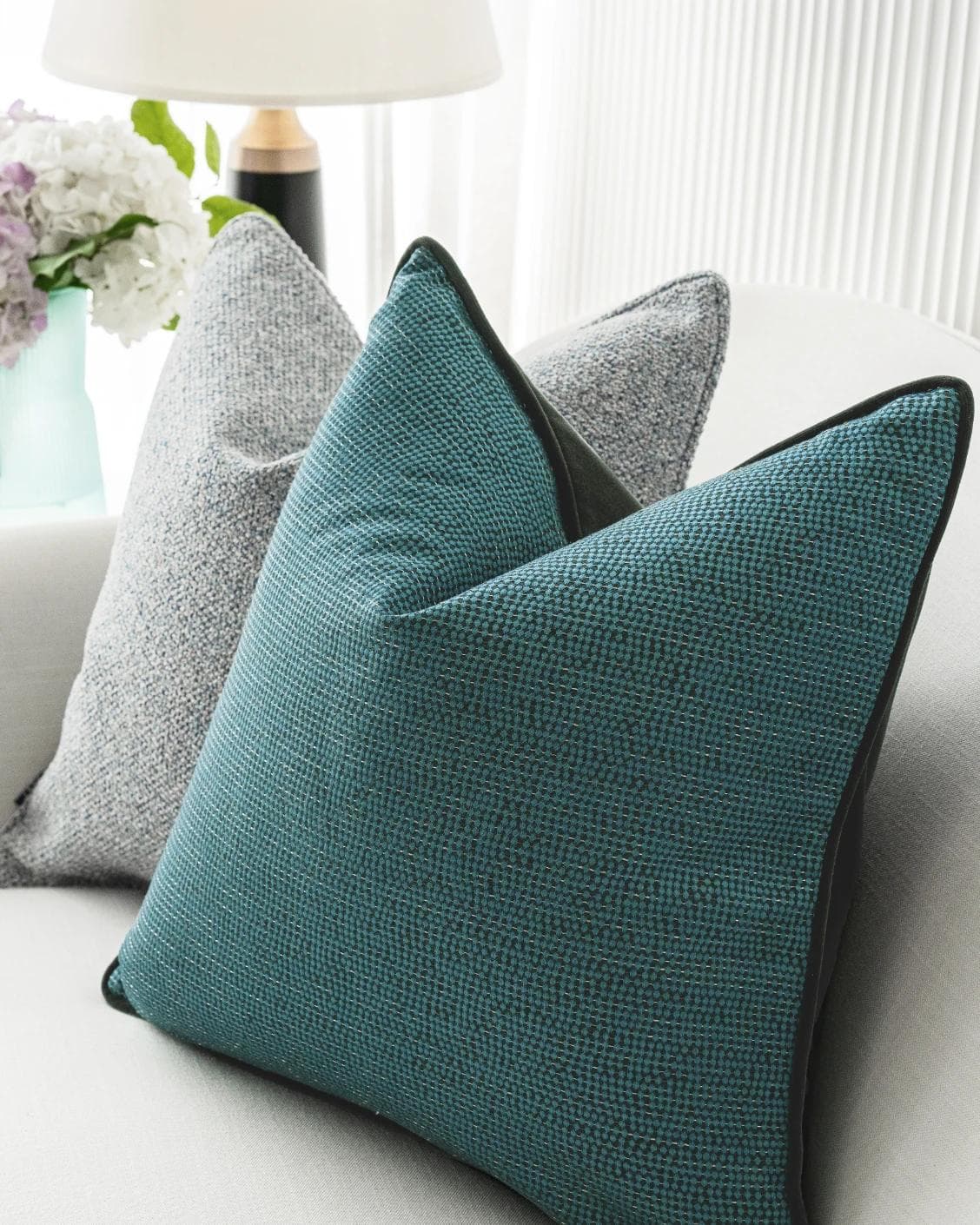 Henrich Bundle cushion in blue, shown in a lifestyle right view as image 6