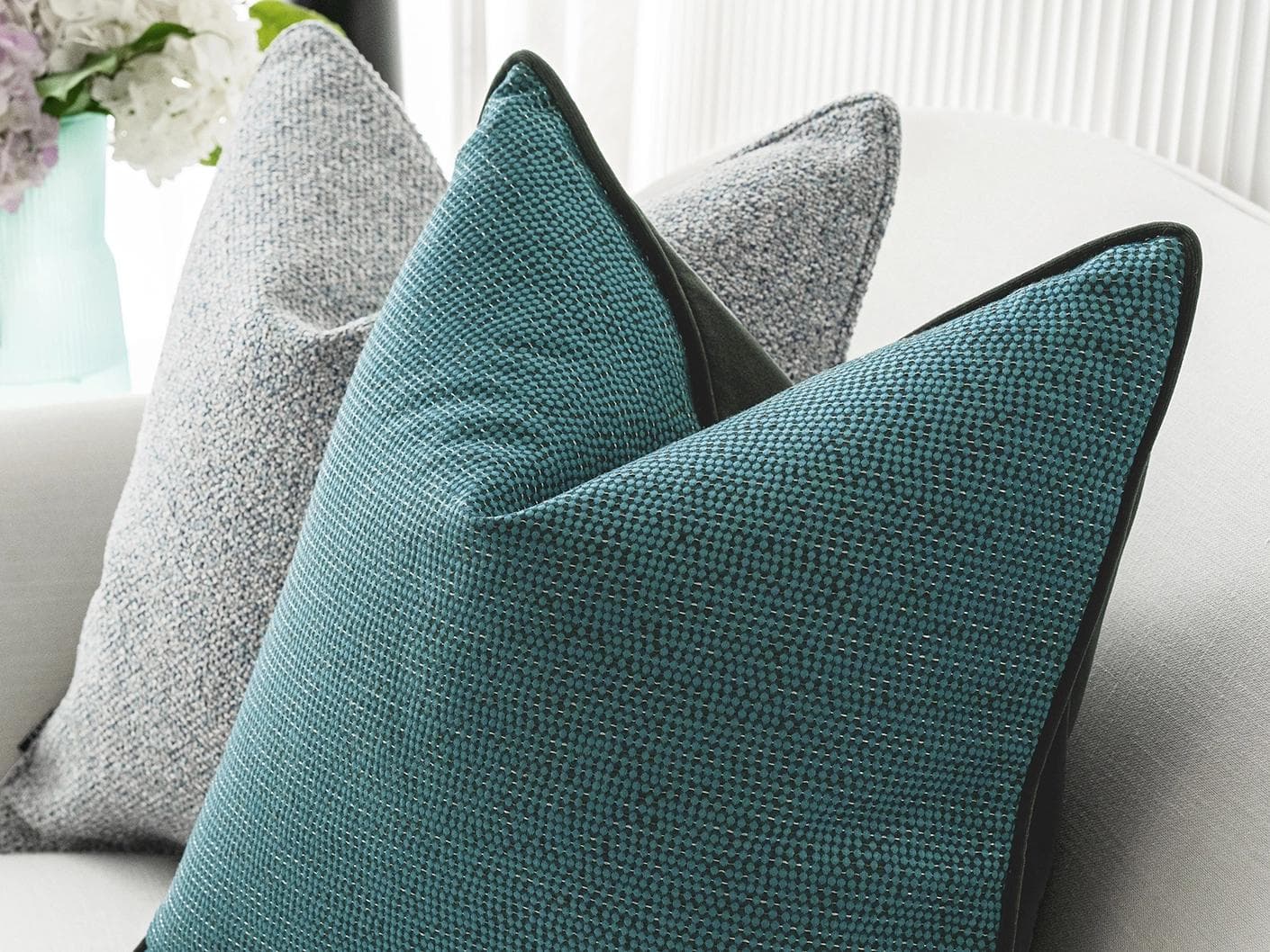 Henrich Bundle cushion in blue, shown in a lifestyle right view as image 6