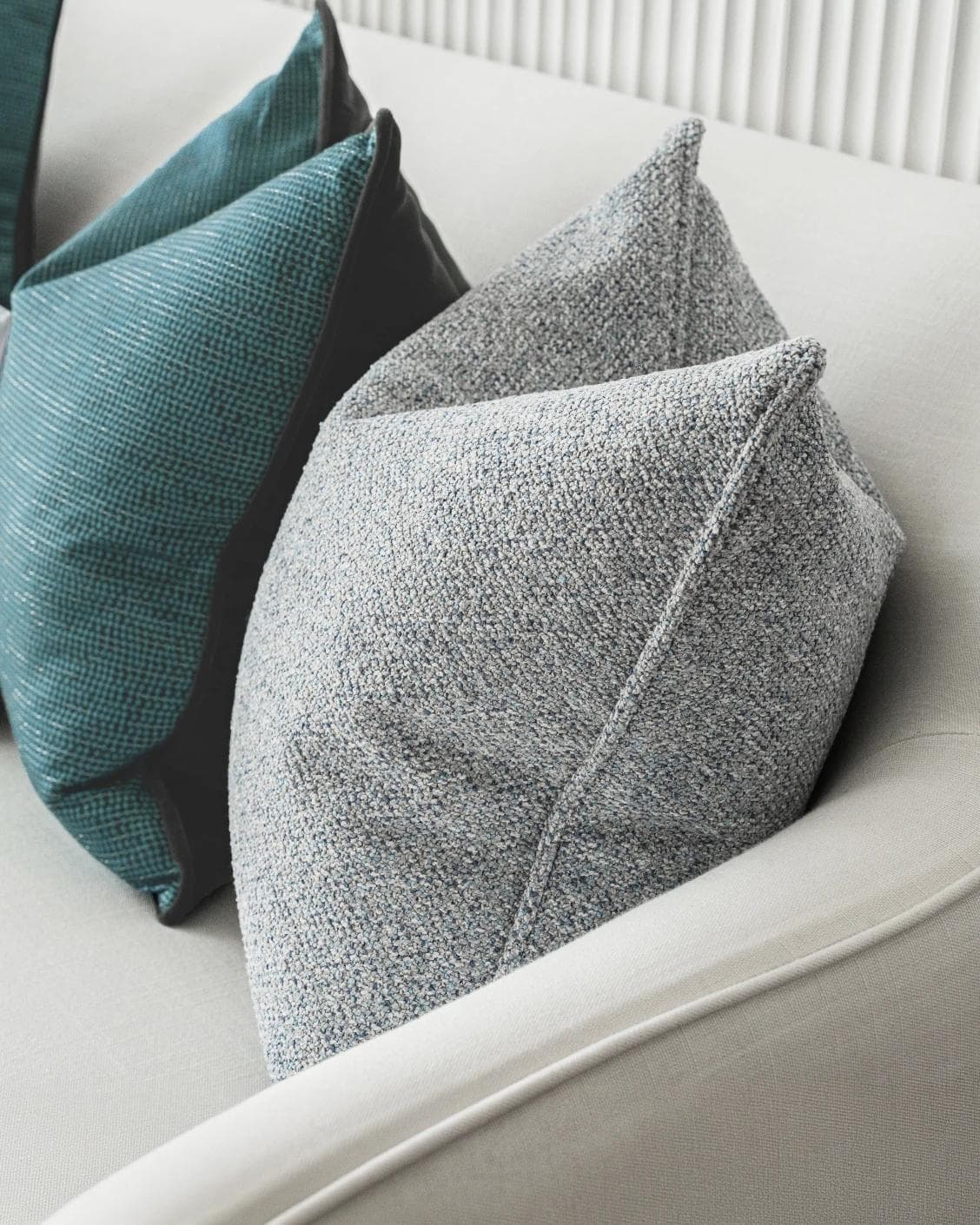 Henrich Bundle cushion in blue, shown in a product right view as image 8