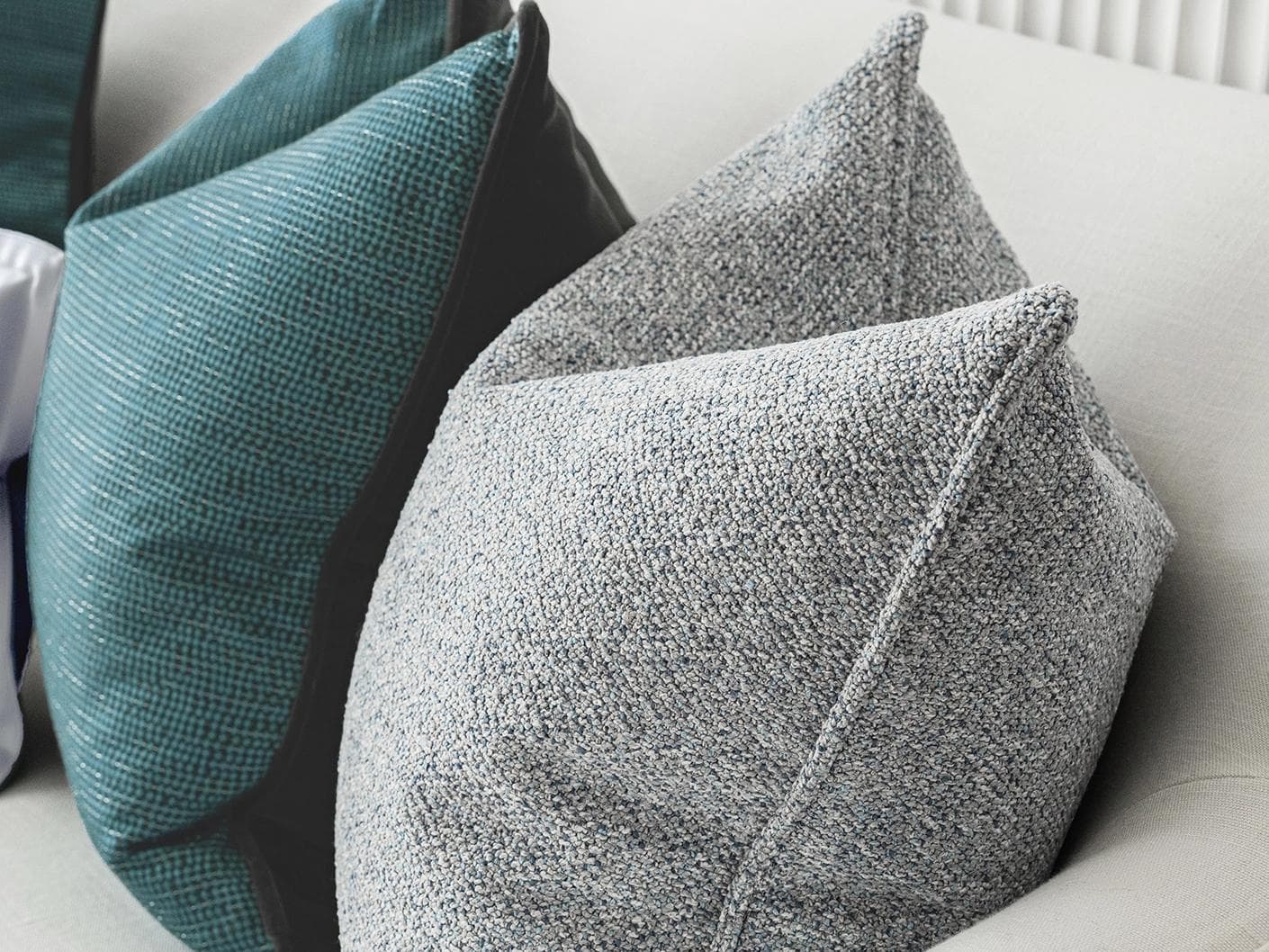 Henrich Bundle cushion in blue, shown in a product right view as image 8