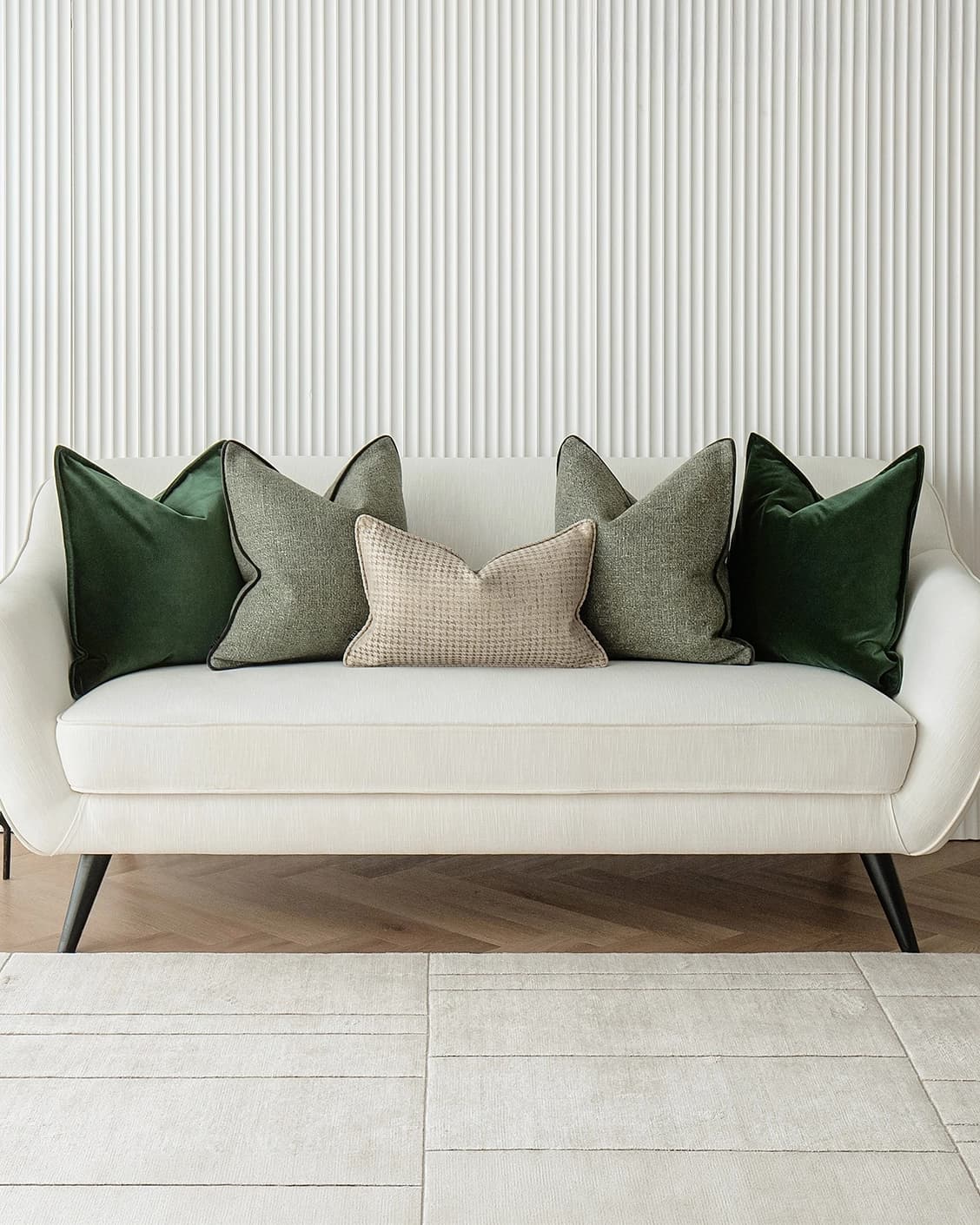 Aneeza Bundle cushion in green and gold, shown in a lifestyle front view as image 2