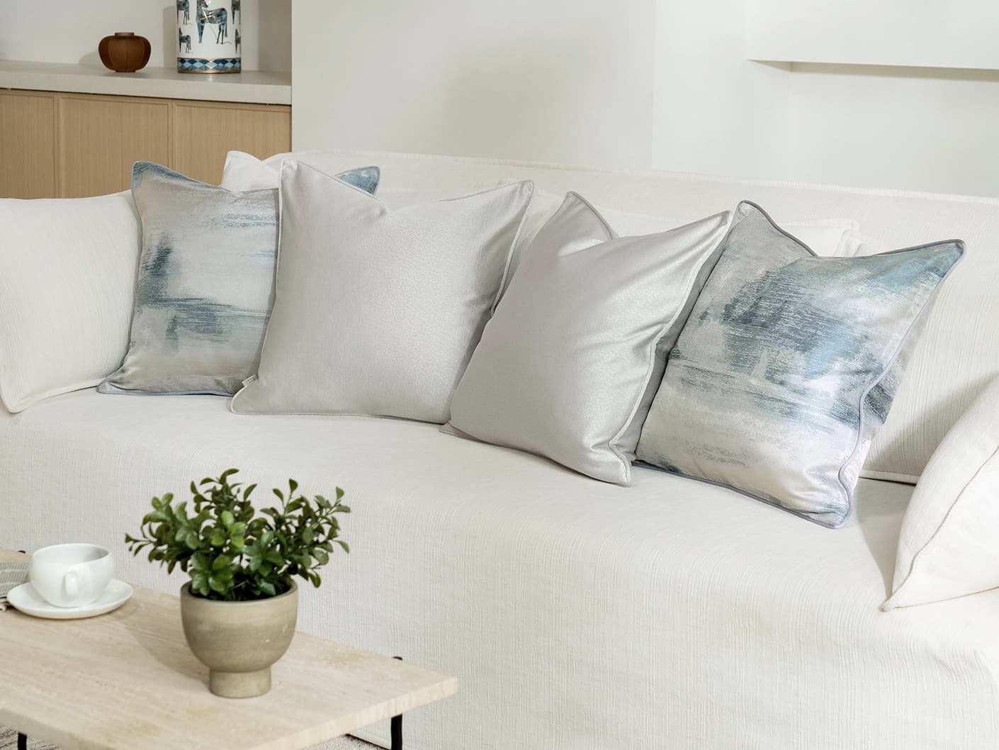 Celia Bundle cushion in blue and silver, shown in a lifestyle right view as image 2