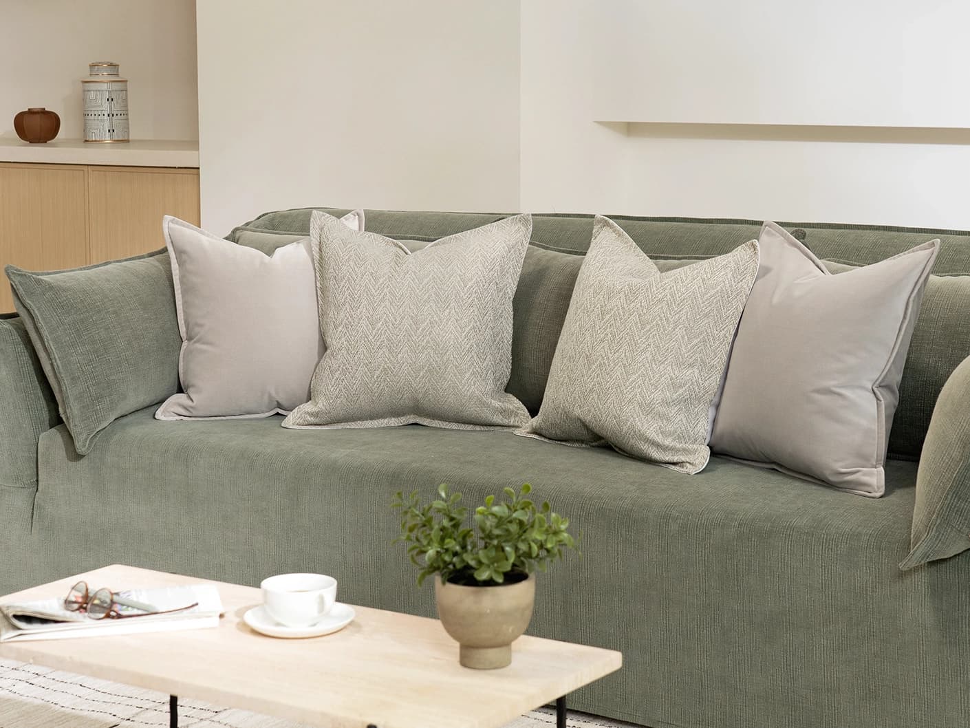 Ezra Bundle bundle cushions in beige, shown in a lifestyle front view