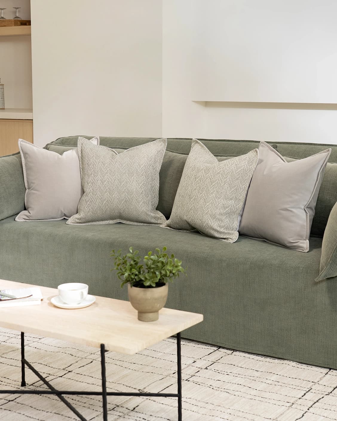 Ezra Bundle cushion in beige, shown in a lifestyle right view as image 2