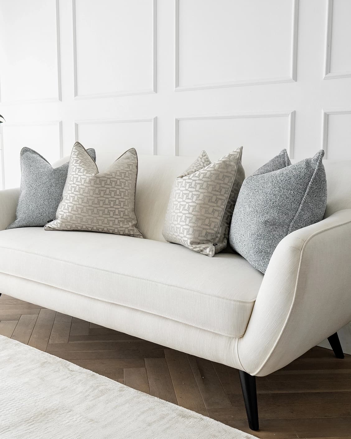 Jameela Bundle cushion in blue, beige and silver, shown in a lifestyle right view as image 2