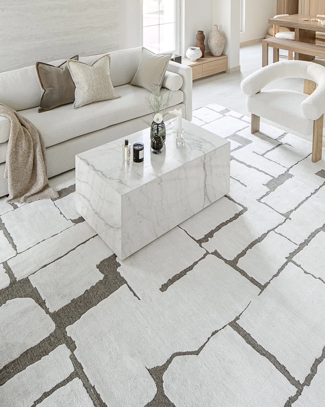 Nico Sandy carpet in ivory, grey and brown, shown in a lifestyle left view as image 6