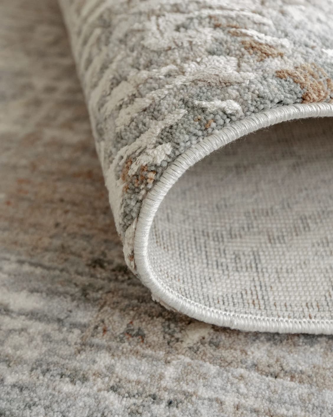 Savanna Sandy carpet in beige and rust, shown in a lifestyle close-up as image 4