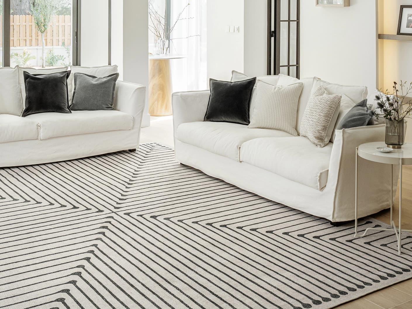 Vince Bianca carpet in black and white, shown in a lifestyle front view as image 5
