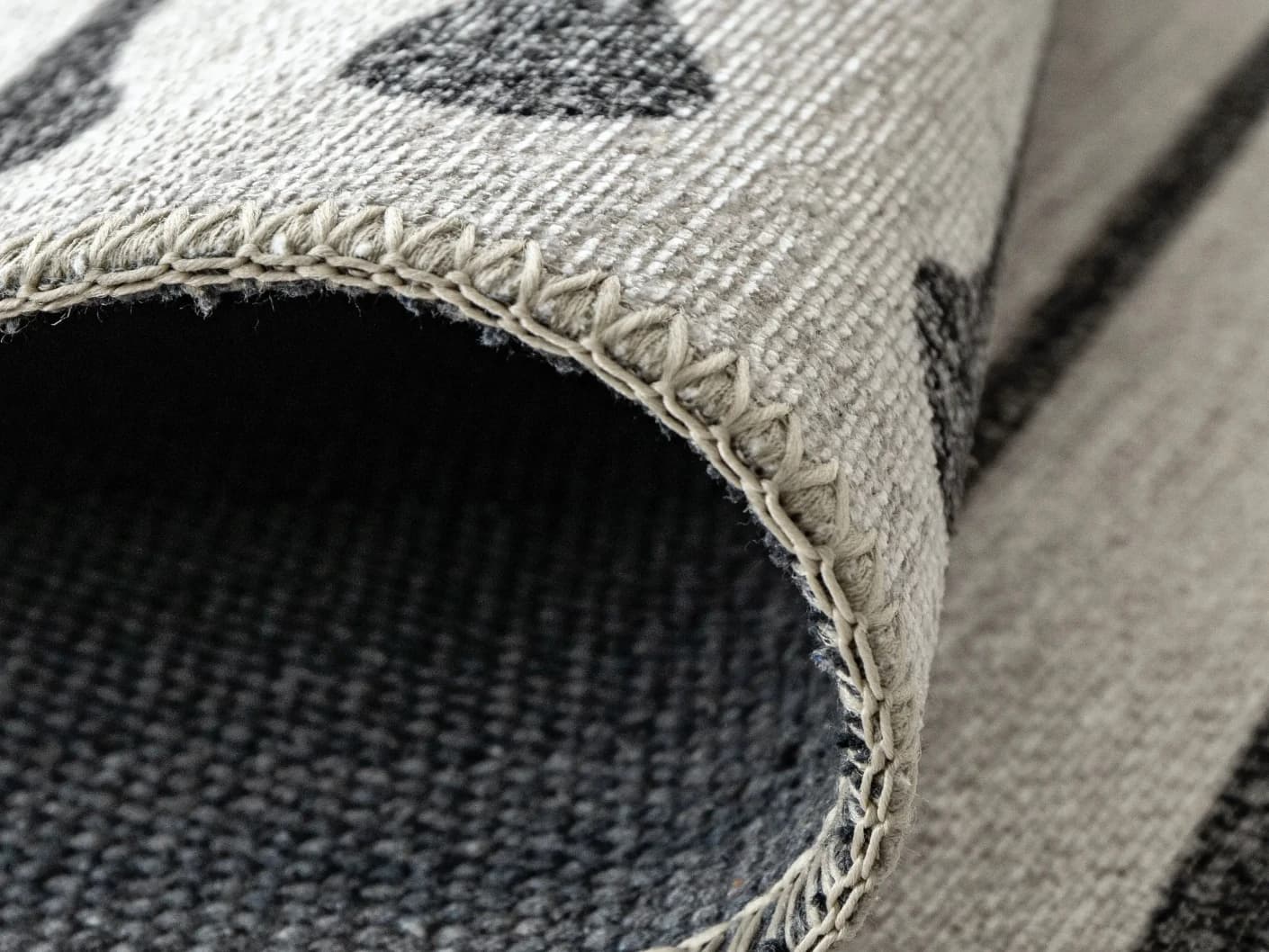 Vince Bianca carpet in black and white, shown in a lifestyle front view as image 4