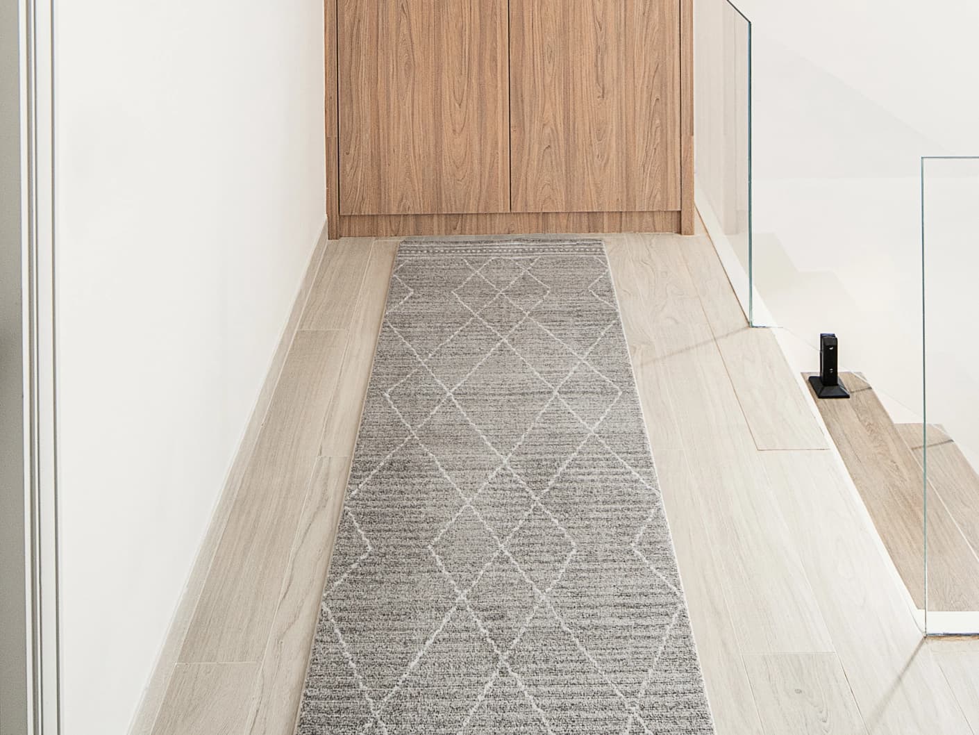 Zen Dune Runners carpet in grey and off white, shown in a lifestyle front view
