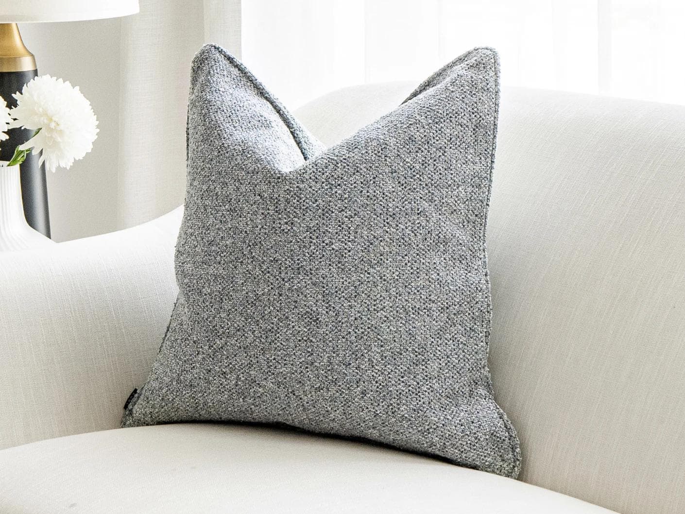 Oscar Canova cushion in blue, shown in a lifestyle front view as image 4