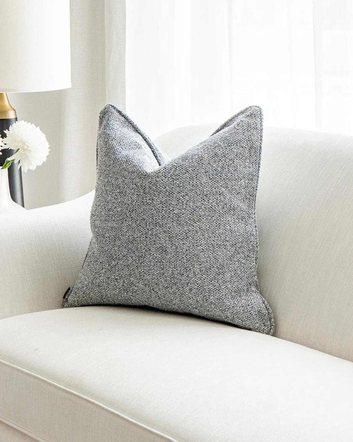 Oscar Canova cushion in blue, shown in a lifestyle front view as image 4