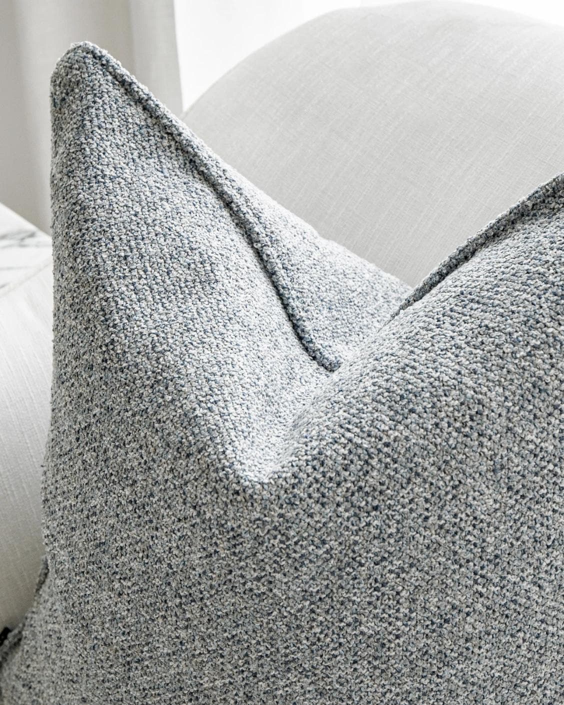 Oscar Canova cushion in blue, shown in a lifestyle top view as image 6