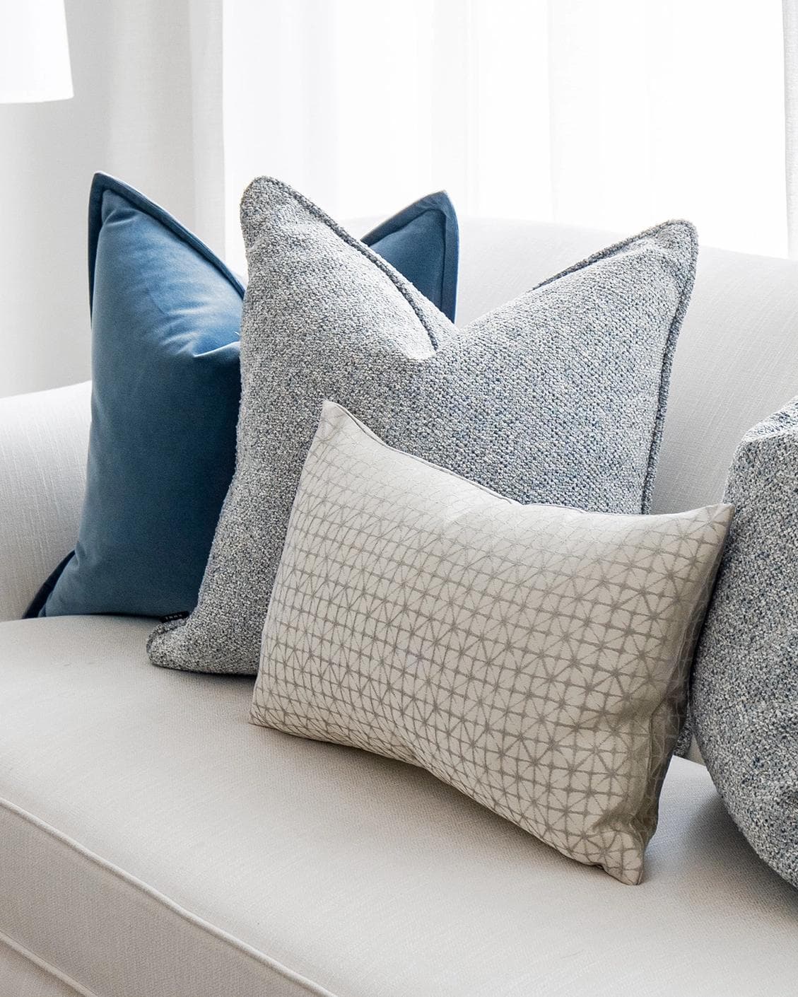 Samuel Bundle cushion in blue, silver and white, shown in a product right view as image 5