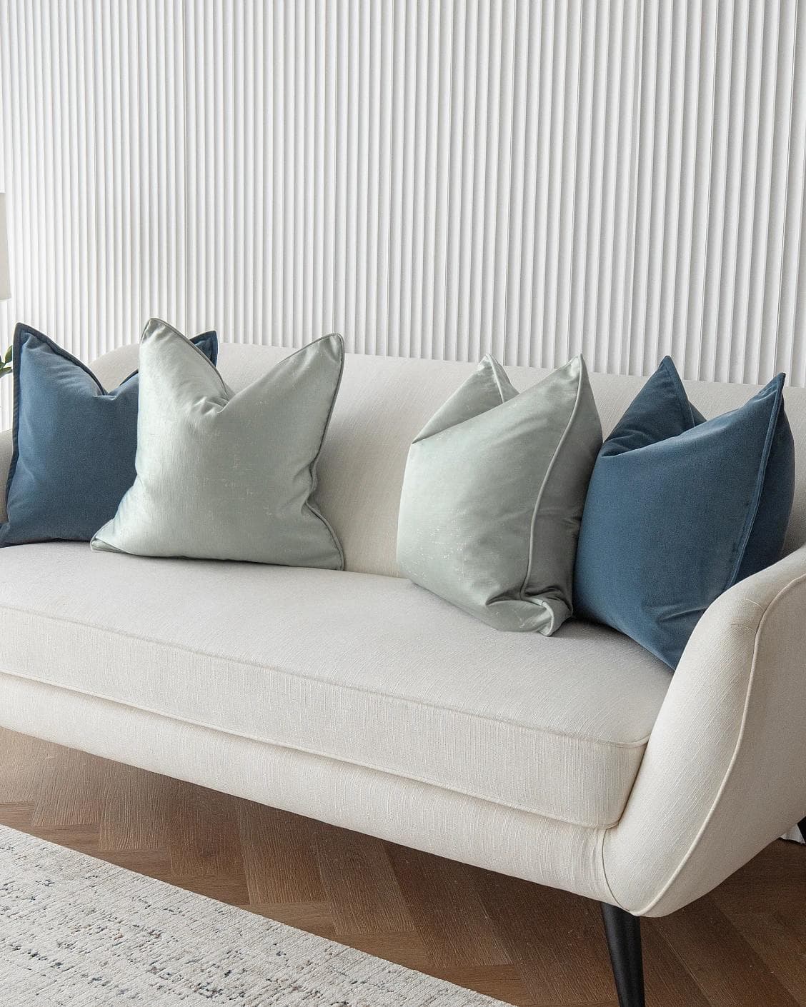 Vladimir Bundle cushion in blue, green and silver, shown in a lifestyle right view as image 4