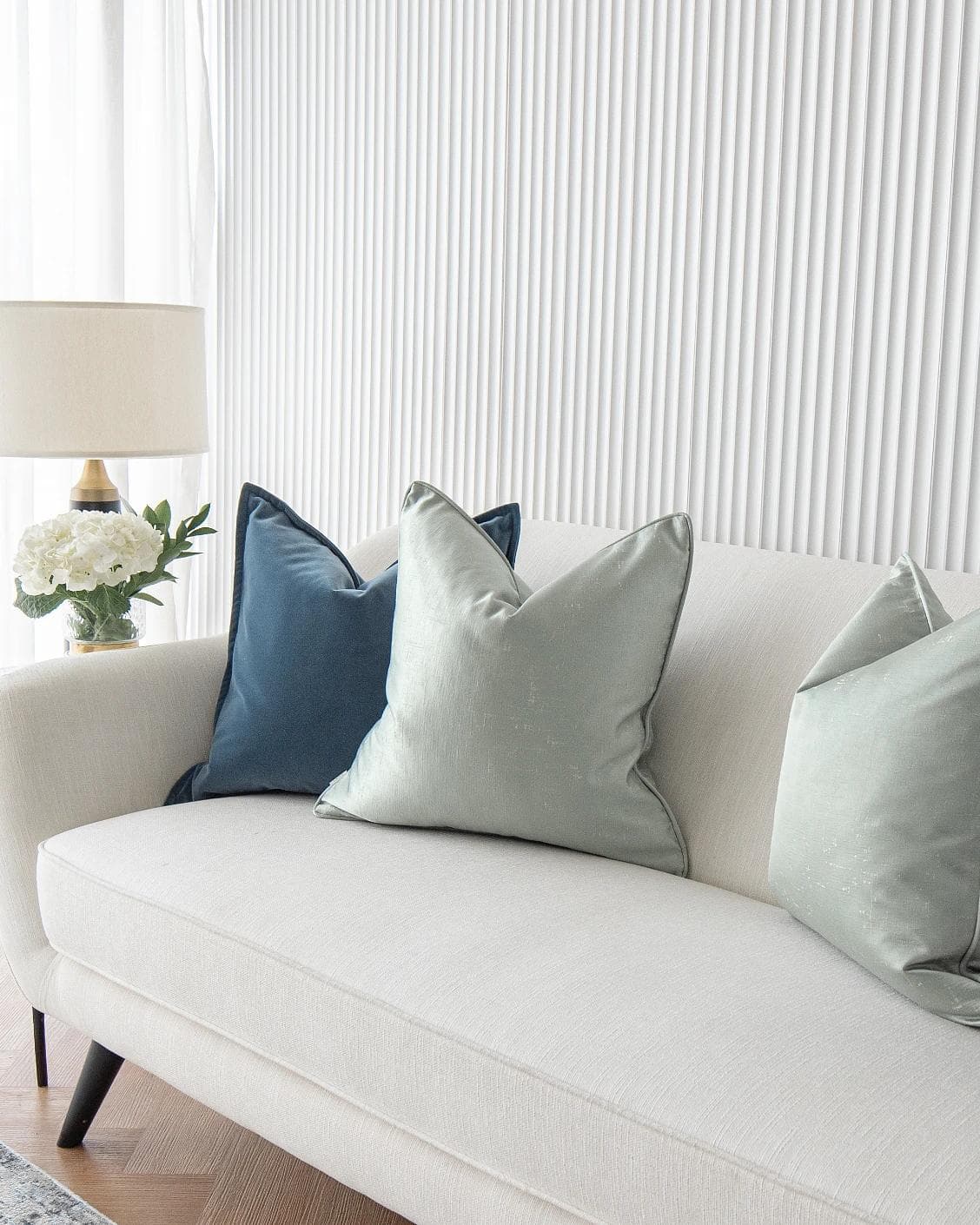 Vladimir Bundle cushion in blue, green and silver, shown in a lifestyle right view as image 5