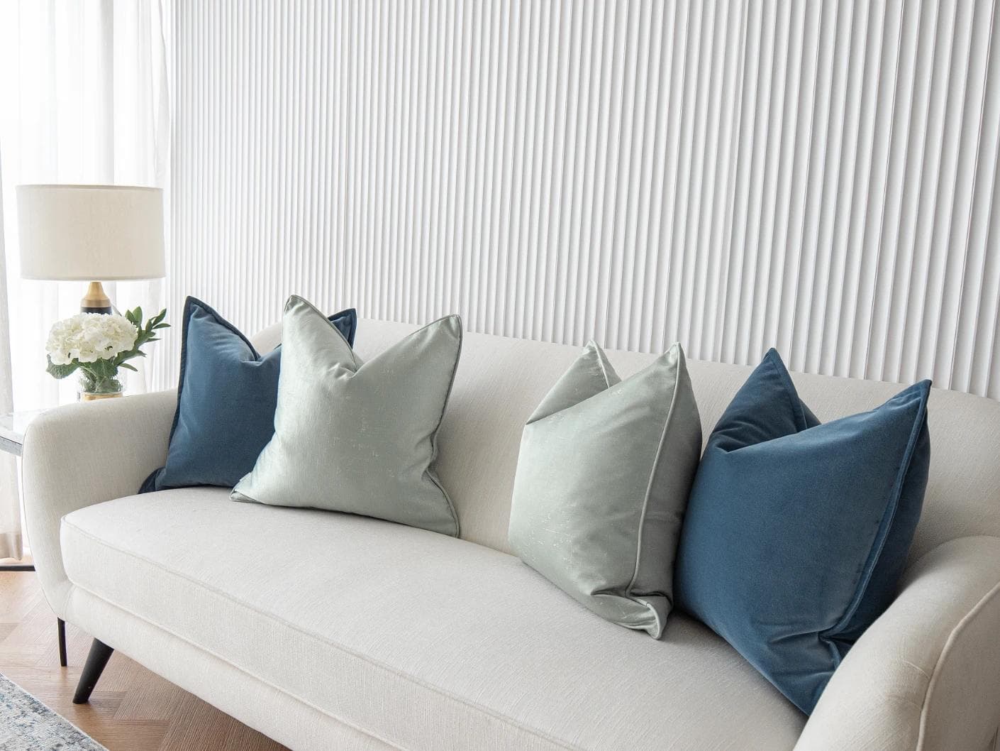 Vladimir Bundle cushion in blue, green and silver, shown in a lifestyle right view as image 5