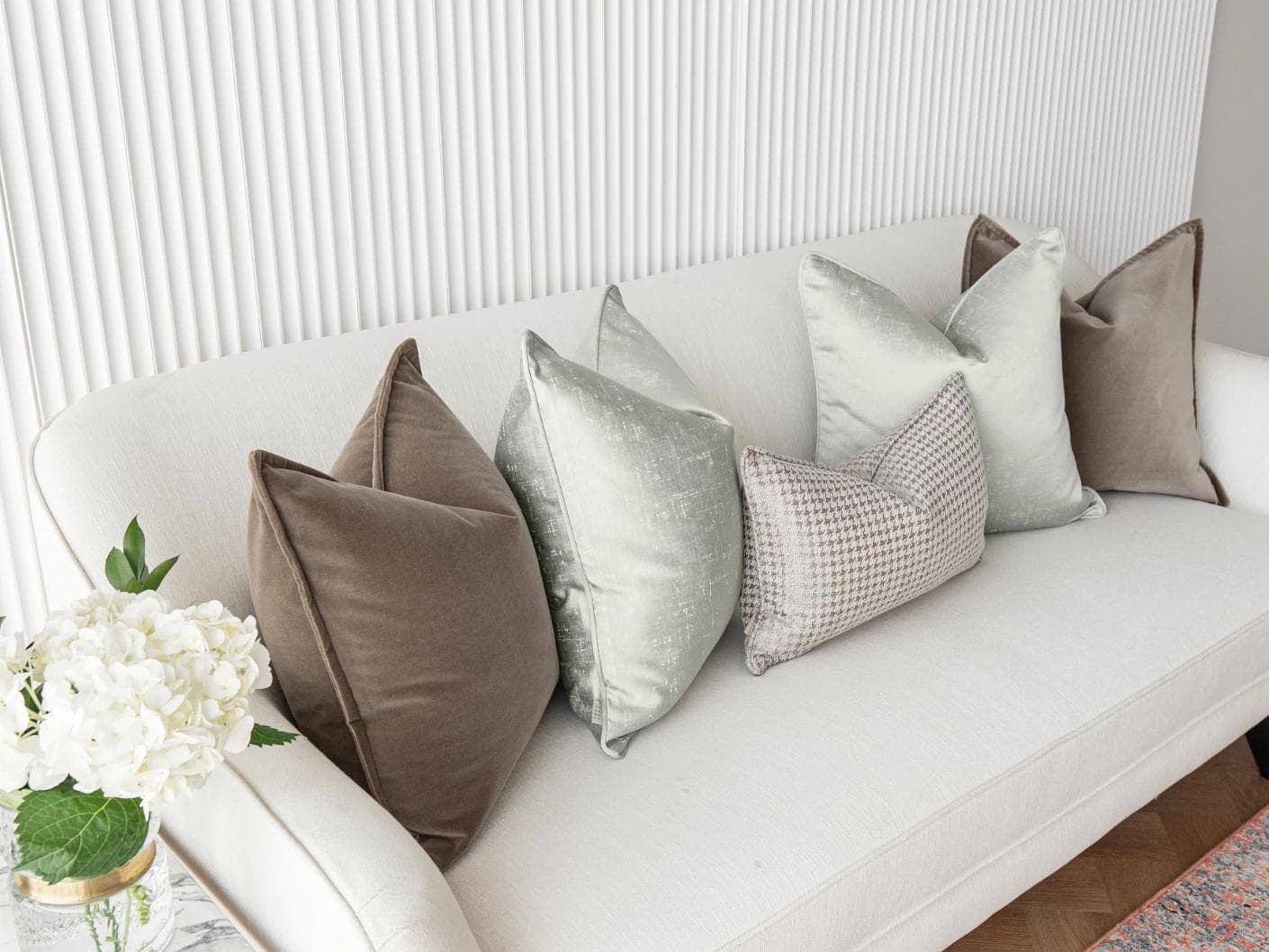Amaris Bundle cushion in brown, green and silver, shown in a lifestyle left view as image 5