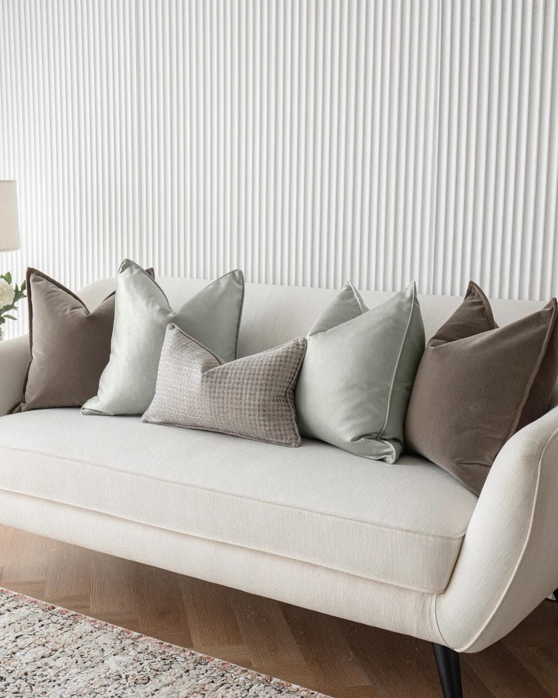Amaris Bundle cushion in brown, green and silver, shown in a lifestyle right view as image 2