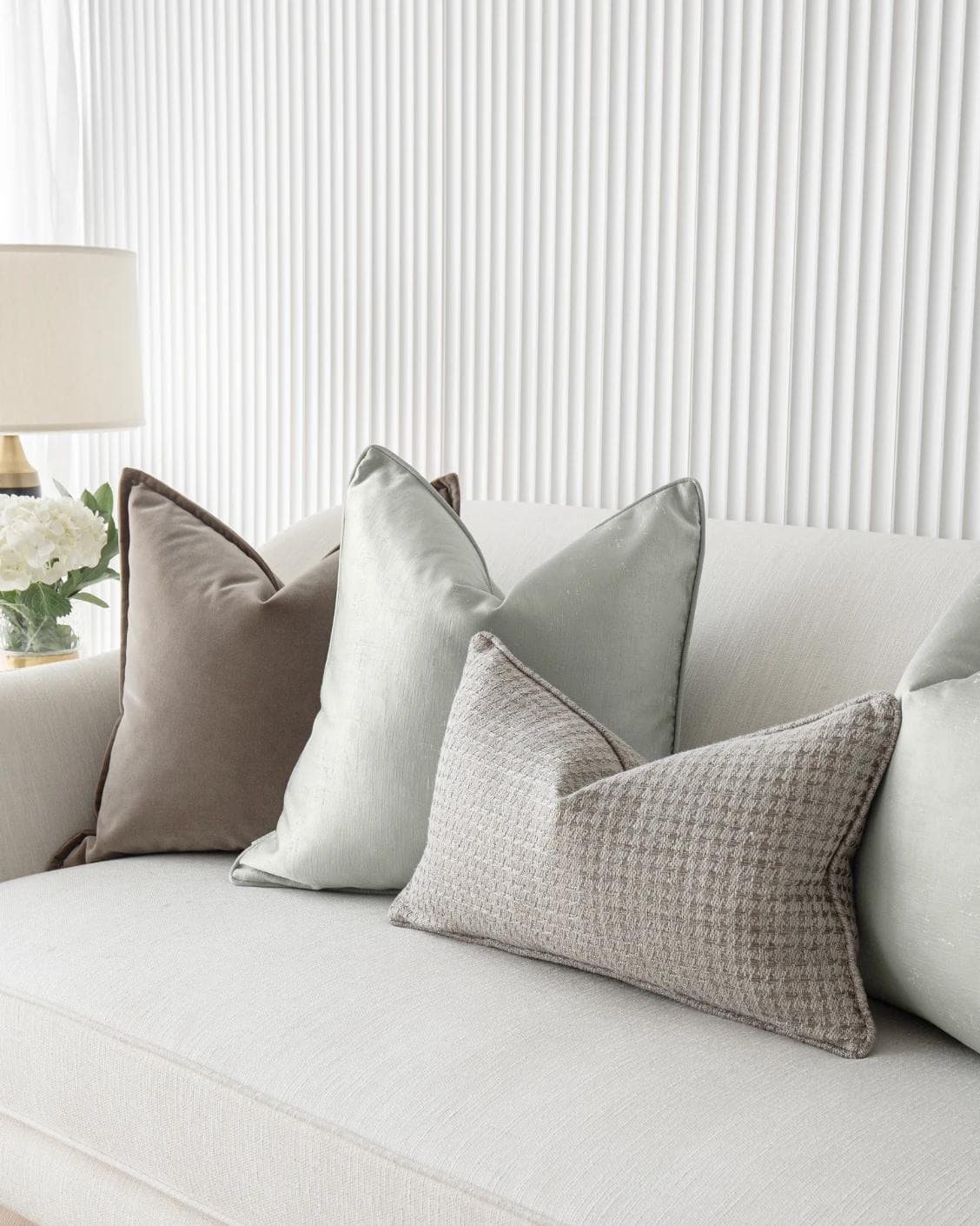 Amaris Bundle cushion in brown, green and silver, shown in a lifestyle right view as image 6