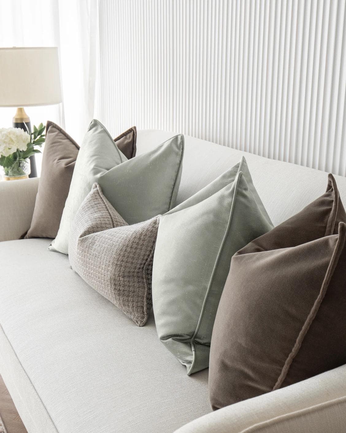 Amaris Bundle cushion in brown, green and silver, shown in a lifestyle right view as image 7