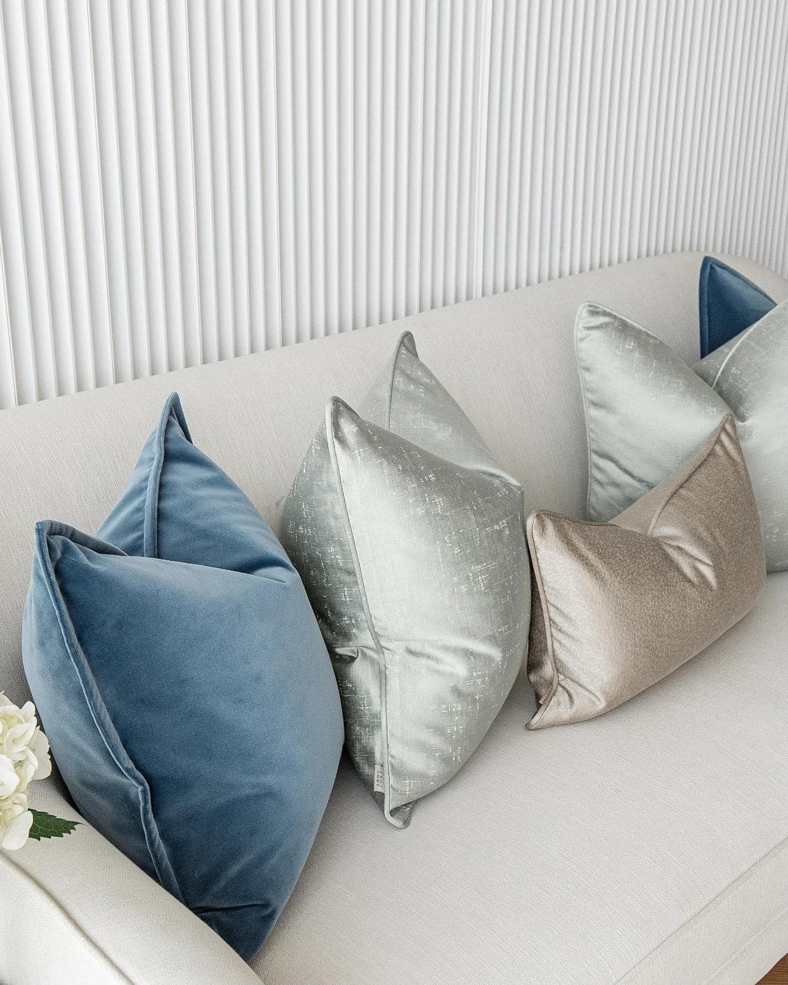 Johnston Bundle cushion in gold, blue, beige, green and silver, shown in a product left view as image 5