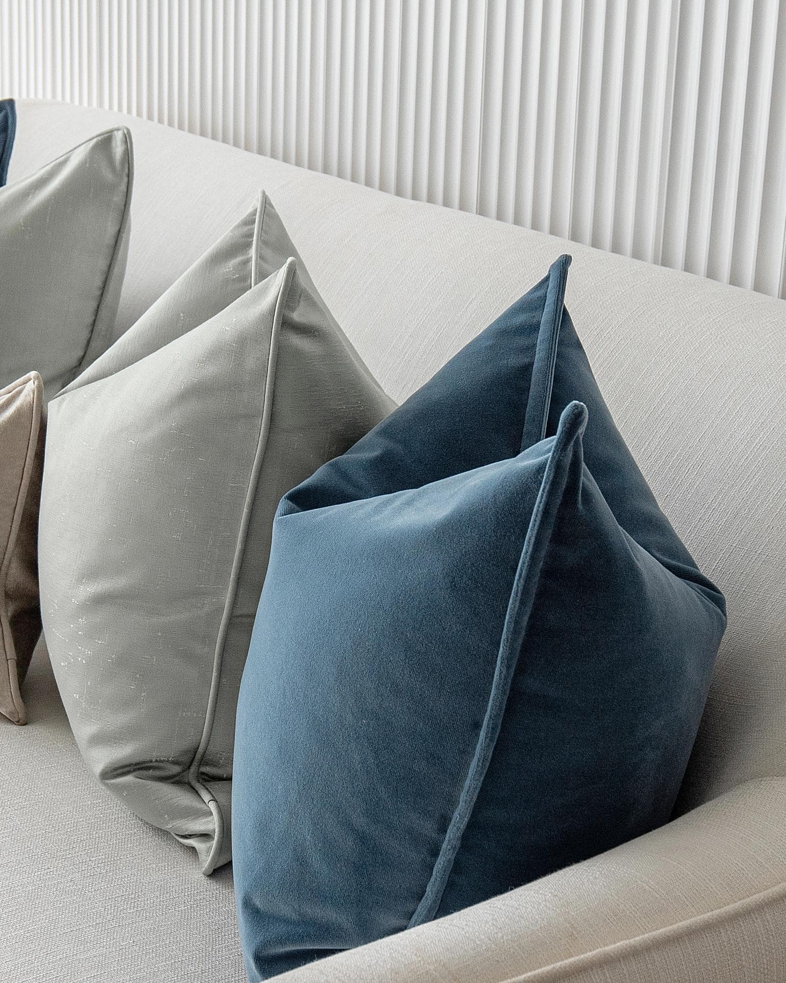 Johnston Bundle cushion in gold, blue, beige, green and silver, shown in a product right view as image 7