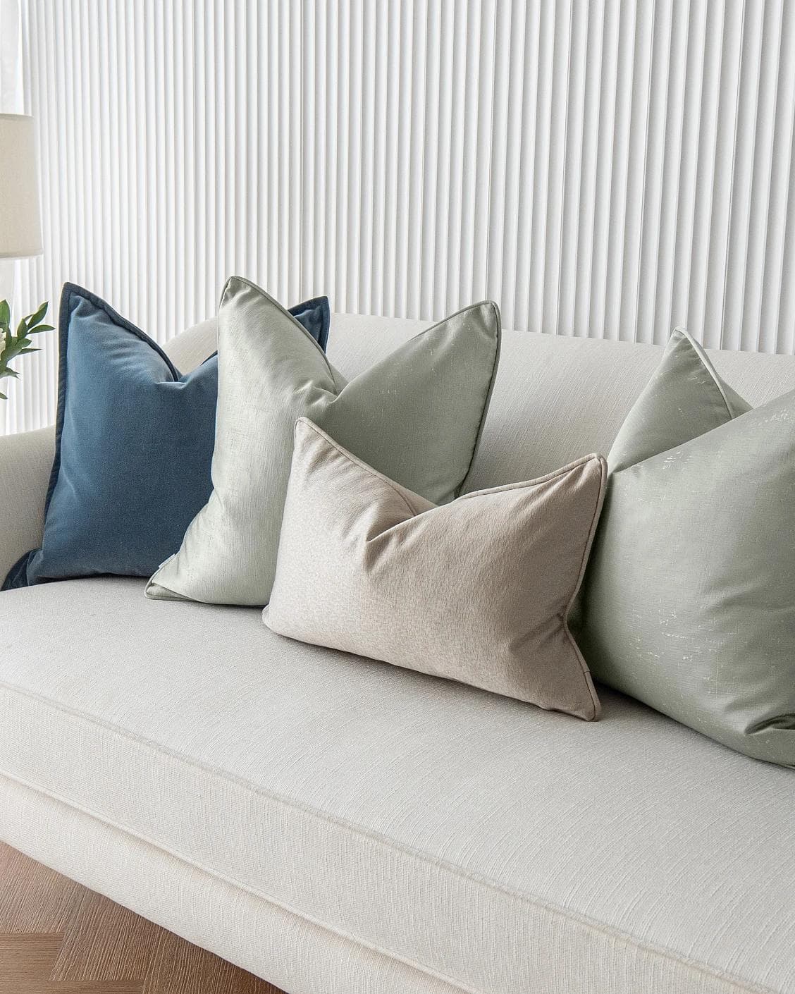 Johnston Bundle cushion in gold, blue, beige, green and silver, shown in a product right view as image 6